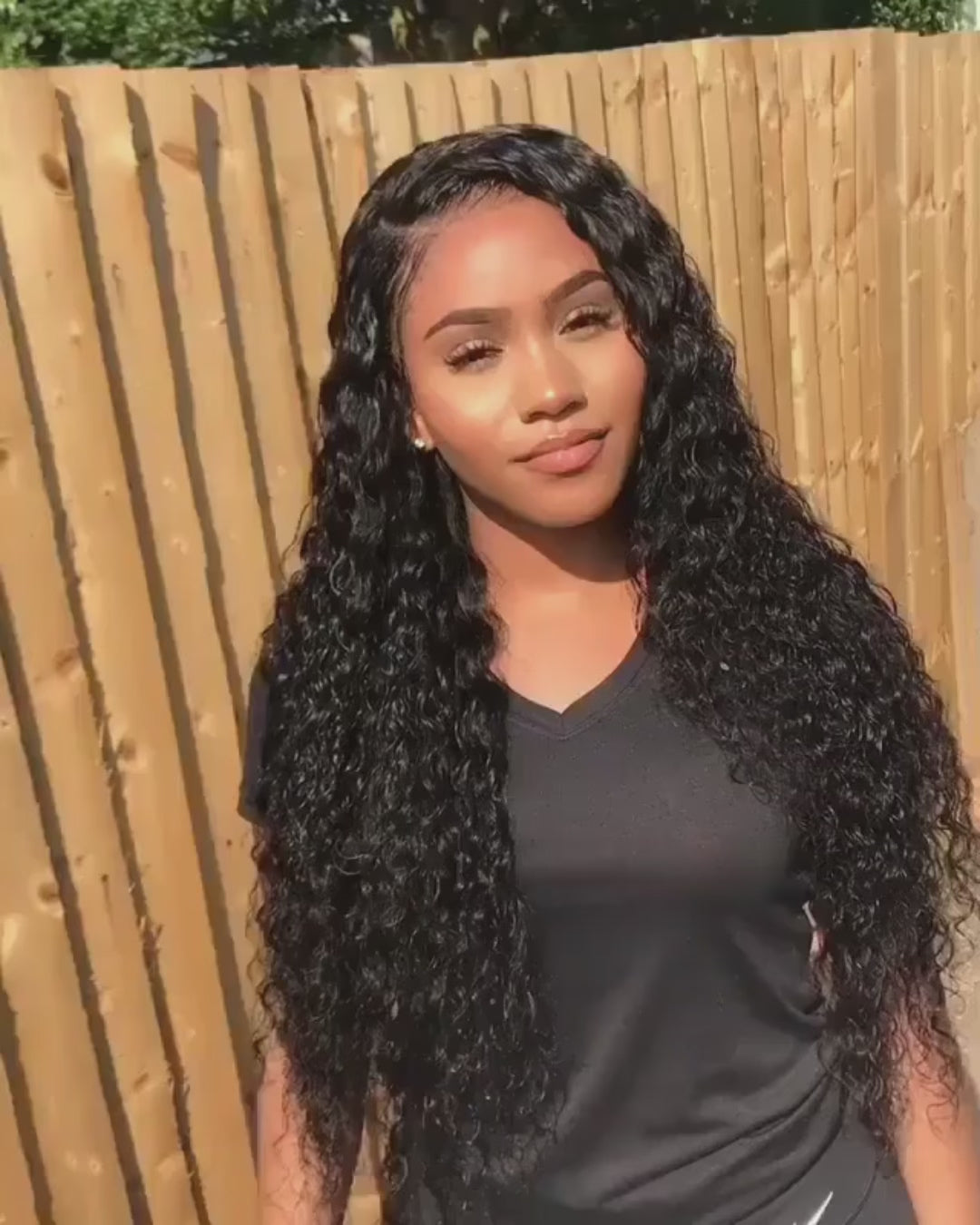 showcasing model video of black waterwave wig